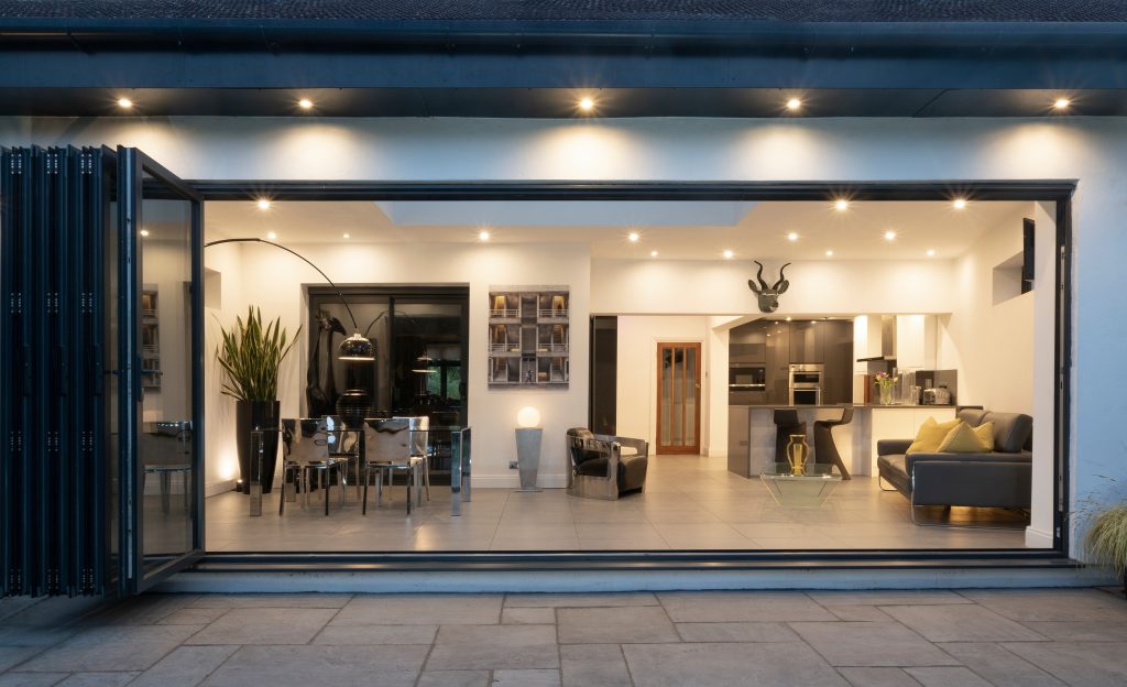 Wide bi-folding doors to a modern interior