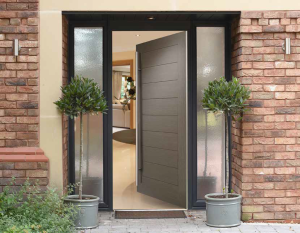 Brown composite front door with large bar handle