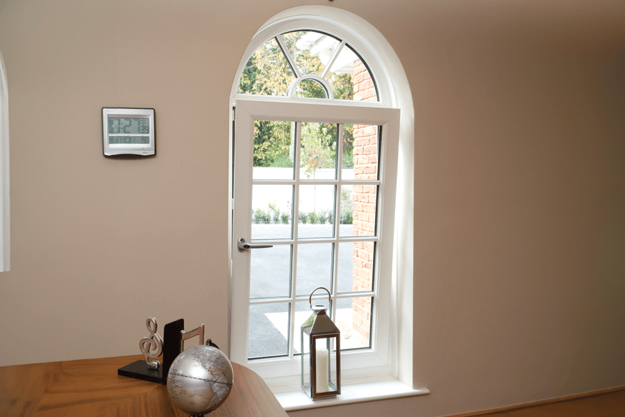 White tilt and turn windows arched
