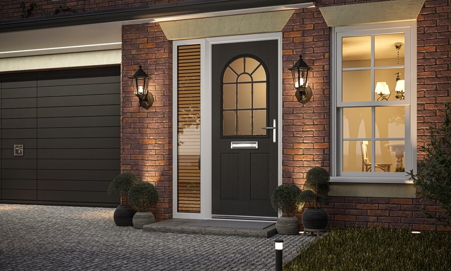 Modern black composite front door with grid design in a sleek contemporary home.